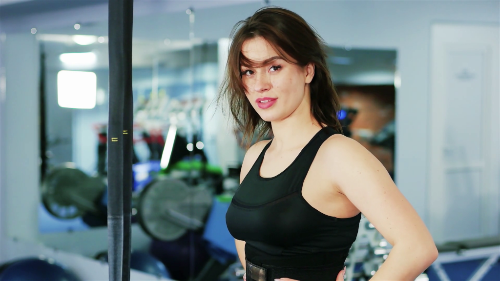 portrait-of-a-beautiful-woman-in-a-sports-hall-the-girl-athlete-with-long-hair-sexy-flirting-looking-into-the-camera-workout-women-sports-against-the-backdrop-of-fitness-equipment_rapamwefe_thumbn.png